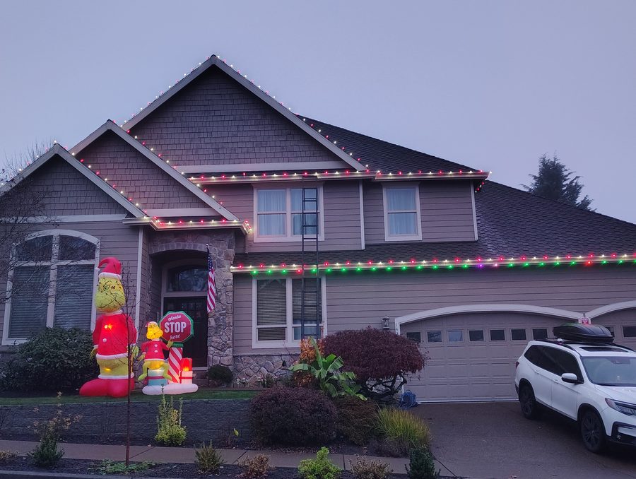 Christmas lights on the roofline of a two-story Portland home, installed by HomeHaven Northwest in November 2025