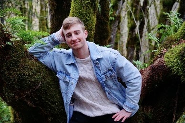 Max Brown, owner of HomeHaven Northwest, in a mossy Portland forest